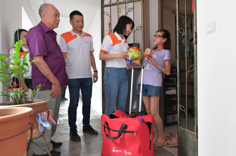 Thousands of needy residents receive hongbao, gift packs in charity drives ahead of CNY